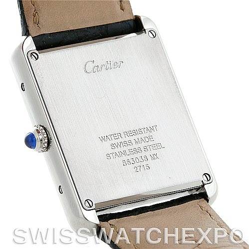This image shows the back case of a Cartier Tank Solo W1018355 Men
s Stainless Steel Silver Dial W1018355 Men
s Stainless Steel Silver Dial watch, highlighting its inscriptions and leather strap attachments.