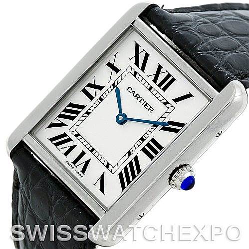 The image shows a Cartier Tank Solo W1018355 Men's Stainless Steel Silver Dial W1018355 Men's Stainless Steel Silver Dial watch at an angled view, focusing on the face, bezel, crown with a blue cabochon, and black strap.