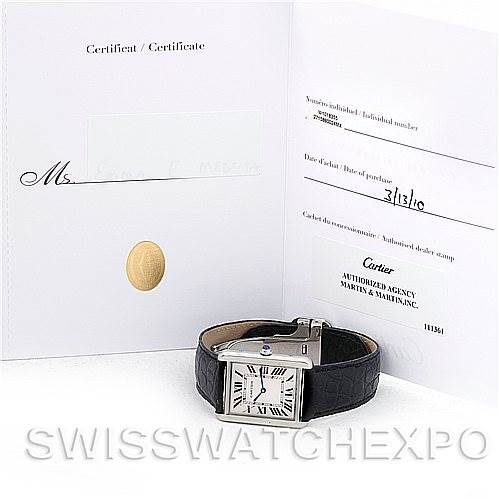 The image shows the Cartier Tank Solo W1018355 Men's Stainless Steel Silver Dial W1018355 Men's Stainless Steel Silver Dial watch with a leather strap, positioned next to its certificate and authentication papers.
