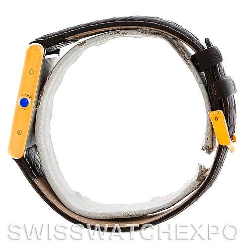 The image shows a side view of the Cartier Tank Solo W1018855 Men
s Steel and Gold (two tone) Silver Dial W1018855 Men
s Steel and Gold (two tone) Silver Dial watch, highlighting the crown and leather strap.