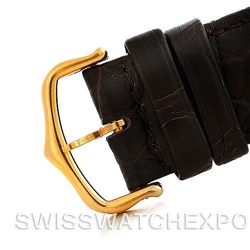 This image shows the gold buckle and black strap of a Cartier Tank Solo W1018855 Men
s Steel and Gold (two tone) Silver Dial W1018855 Men
s Steel and Gold (two tone) Silver Dial watch from a side angle.