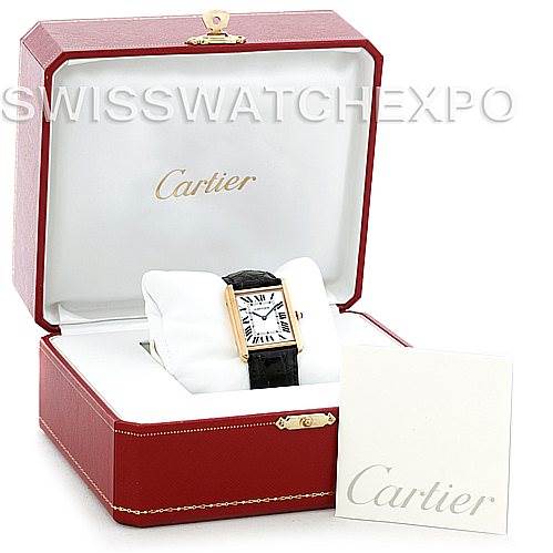 This image shows a Cartier Tank Solo W1018855 Men
s Steel and Gold (two tone) Silver Dial W1018855 Men
s Steel and Gold (two tone) Silver Dial watch in a red Cartier box, accompanied by a white booklet.