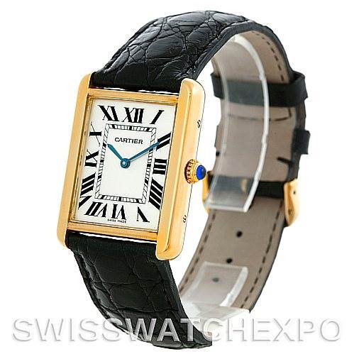 The image shows a Cartier Tank Solo W1018855 Men
s Steel and Gold (two tone) Silver Dial W1018855 Men
s Steel and Gold (two tone) Silver Dial watch at an angled side view, highlighting its rectangular face and black leather strap.