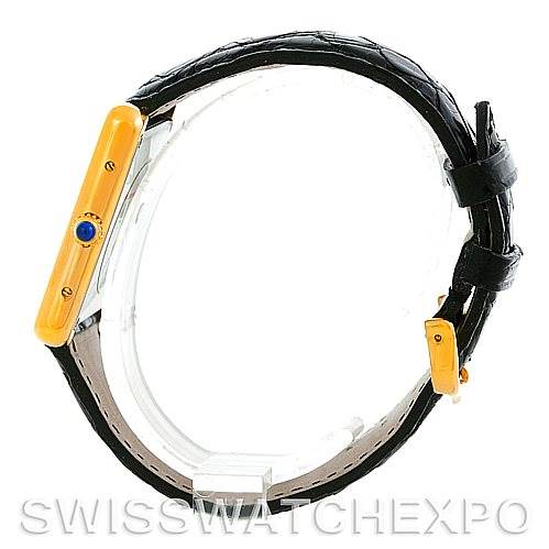 This image shows a side view of the Cartier Tank Solo W1018855 Men
s Steel and Gold (two tone) Silver Dial W1018855 Men
s Steel and Gold (two tone) Silver Dial watch with its gold casing and black leather strap.