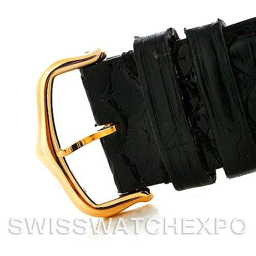This image shows a close-up of the buckle of a black leather strap from the Cartier Tank Solo W1018855 Men
s Steel and Gold (two tone) Silver Dial W1018855 Men
s Steel and Gold (two tone) Silver Dial watch, including the gold buckle and loops.