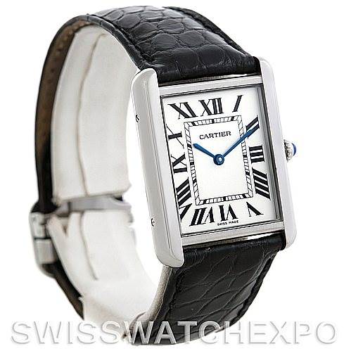 The image shows the front view of the Cartier Tank Solo W1018355 Men
s Stainless Steel Silver Dial W1018355 Men
s Stainless Steel Silver Dial watch, highlighting its rectangular face, Roman numerals, blue hands, and black leather strap.