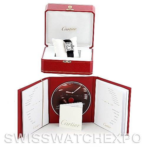 The image shows a Cartier Tank Solo W1018355 Men
s Stainless Steel Silver Dial W1018355 Men
s Stainless Steel Silver Dial watch in its box along with its accompanying booklet and CD.