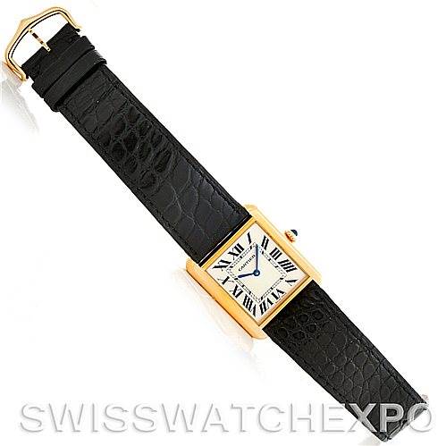 This image shows a full frontal view of a Cartier Tank Solo W1018855 Men
s Steel and Gold (two tone) Silver Dial W1018855 Men
s Steel and Gold (two tone) Silver Dial watch, displaying its black leather strap and rectangular gold case.