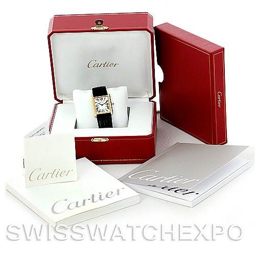 The image shows a Cartier Tank Solo W1018855 Men
s Steel and Gold (two tone) Silver Dial W1018855 Men
s Steel and Gold (two tone) Silver Dial watch in its open box, along with its outer packaging and accompanying booklets.