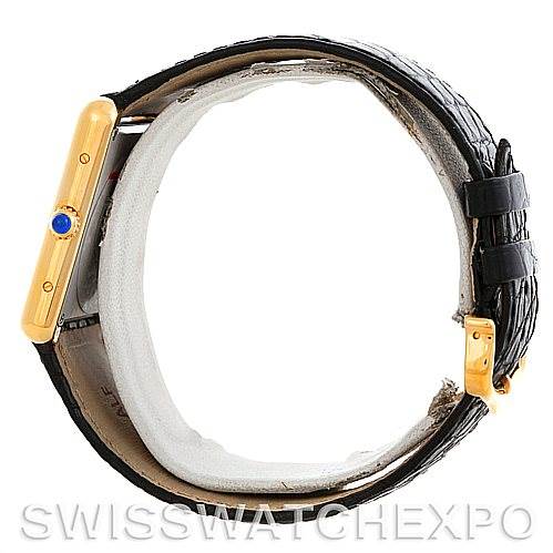 The image shows a side view of a Cartier Tank Solo W1018855 Men
s Steel and Gold (two tone) Silver Dial W1018855 Men
s Steel and Gold (two tone) Silver Dial watch, focusing on the case, crown, and strap.