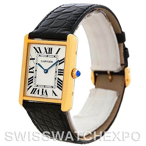 The image shows a Cartier Tank Solo W1018855 Men
s Steel and Gold (two tone) Silver Dial W1018855 Men
s Steel and Gold (two tone) Silver Dial watch at a slight angle, highlighting its dial, black leather strap, and gold case with a blue cabochon crown.