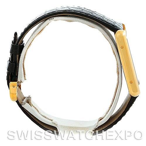 The image shows a Cartier Tank Solo W1018855 Men
s Steel and Gold (two tone) Silver Dial W1018855 Men
s Steel and Gold (two tone) Silver Dial watch from a side view, highlighting the case and the leather strap.