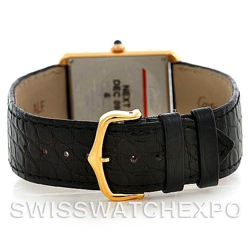 This image shows the back and strap of a Cartier Tank Solo W1018855 Men
s Steel and Gold (two tone) Silver Dial W1018855 Men
s Steel and Gold (two tone) Silver Dial watch, highlighting the gold buckle and black leather strap.