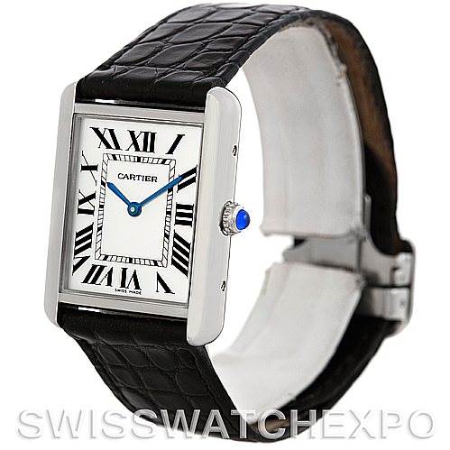 The image shows a Cartier Tank Solo W1018355 Men
s Stainless Steel Silver Dial W1018355 Men
s Stainless Steel Silver Dial watch from a three-quarter angle, displaying the face, crown, and black leather strap.