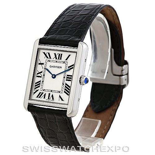 The Cartier Tank Solo W1018355 Men's Stainless Steel Silver Dial W1018355 Men's Stainless Steel Silver Dial watch is shown at an angle displaying its face, black leather strap, crown, and part of the clasp.