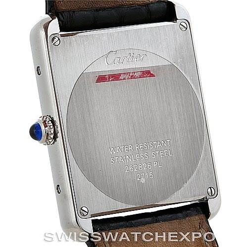 The image shows the back of a Cartier Tank Solo W1018355 Men's Stainless Steel Silver Dial W1018355 Men's Stainless Steel Silver Dial watch, featuring its stainless steel casing, water resistance details, and the crown with a blue cabochon.