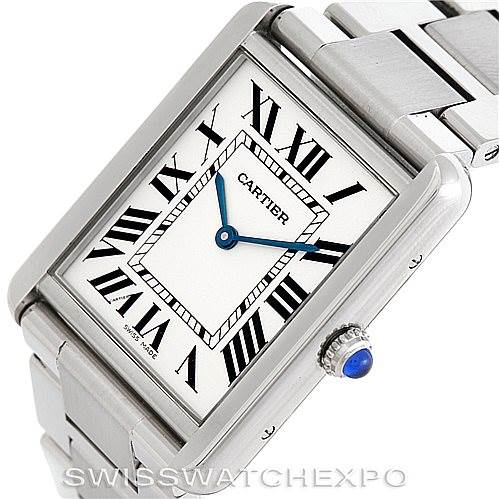 This image shows a Cartier Tank Solo W5200014 Men
s Stainless Steel Silver Dial W5200014 Men
s Stainless Steel Silver Dial watch at an angled view, highlighting its rectangular face, blue hands, Roman numerals, and stainless steel bracelet.