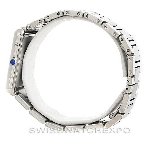 The image shows a side view of the Cartier Tank Solo W5200014 Men
s Stainless Steel Silver Dial W5200014 Men
s Stainless Steel Silver Dial watch, highlighting its bracelet and side case with a blue cabochon crown.