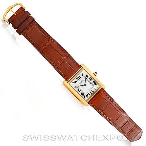 This image shows a top-down view of the Cartier Tank Solo W1018855 Men
s Steel and Gold (two tone) Silver Dial W1018855 Men
s Steel and Gold (two tone) Silver Dial watch with a brown leather strap and gold-tone case.