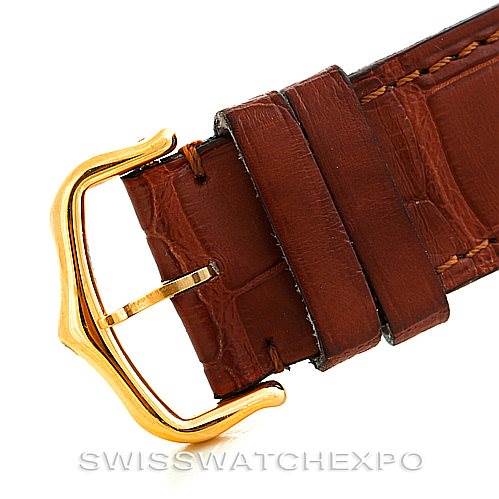The image shows a close-up view of the brown leather strap and gold buckle for the Cartier Tank Solo W1018855 Men
s Steel and Gold (two tone) Silver Dial W1018855 Men
s Steel and Gold (two tone) Silver Dial watch.