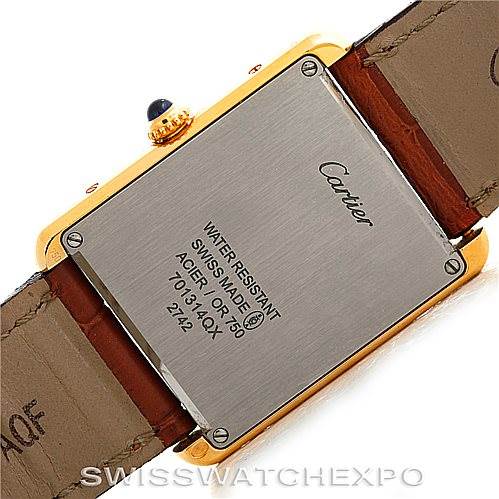 This image shows the back of the Cartier Tank Solo W1018855 Men
s Steel and Gold (two tone) Silver Dial W1018855 Men
s Steel and Gold (two tone) Silver Dial watch, highlighting the case back and leather straps.