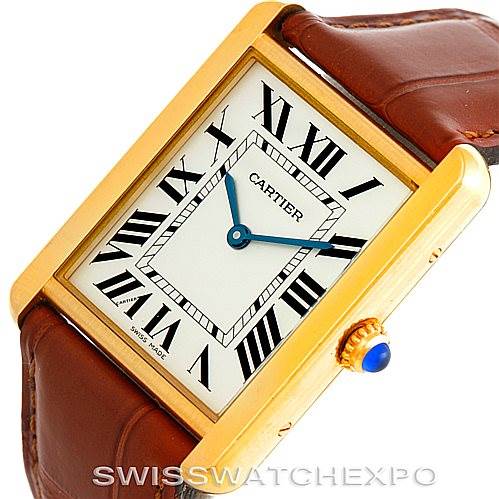 The image shows a Cartier Tank Solo W1018855 Men
s Steel and Gold (two tone) Silver Dial W1018855 Men
s Steel and Gold (two tone) Silver Dial watch at an angled view highlighting the face, crown, and part of the leather strap.