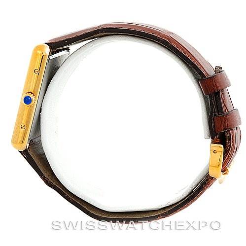 The image shows a side view of the Cartier Tank Solo W1018855 Men
s Steel and Gold (two tone) Silver Dial W1018855 Men
s Steel and Gold (two tone) Silver Dial watch, highlighting the crown, case side, and leather strap.