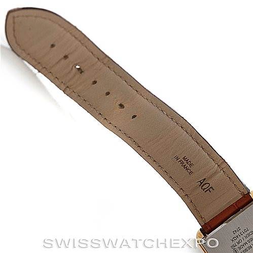 The image shows a close-up of the leather strap and part of the back case of a Cartier Tank Solo W1018855 Men
s Steel and Gold (two tone) Silver Dial W1018855 Men
s Steel and Gold (two tone) Silver Dial watch.