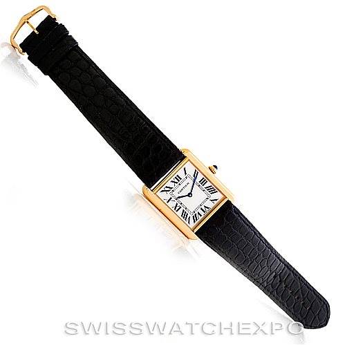 This image shows a top-down view of a Cartier Tank Solo W1018855 Men
s Steel and Gold (two tone) Silver Dial W1018855 Men
s Steel and Gold (two tone) Silver Dial watch with a gold case and black leather strap.
