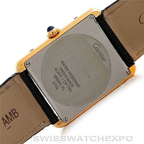 The image shows the back of the Cartier Tank Solo W1018855 Men
s Steel and Gold (two tone) Silver Dial W1018855 Men
s Steel and Gold (two tone) Silver Dial watch, highlighting the case back and leather straps.