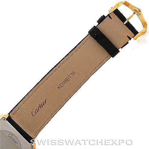 The image shows the backside of the strap and gold buckle of a Cartier Tank Solo W1018855 Men
s Steel and Gold (two tone) Silver Dial W1018855 Men
s Steel and Gold (two tone) Silver Dial watch from a top-down angle.
