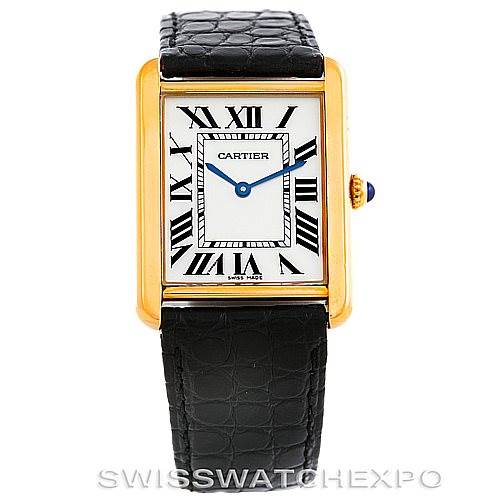 The image shows a frontal view of the Tank Solo model by Cartier, displaying the face, strap, and crown with a blue cabochon.