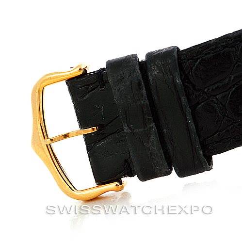 The image shows the gold buckle and a portion of the black leather strap of the Cartier Tank Solo W1018855 Men
s Steel and Gold (two tone) Silver Dial W1018855 Men
s Steel and Gold (two tone) Silver Dial watch.