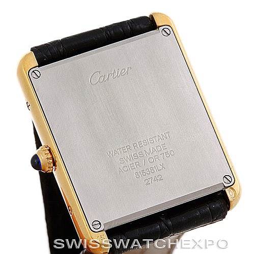 The image shows the back case of a Cartier Tank Solo W1018855 Men
s Steel and Gold (two tone) Silver Dial W1018855 Men
s Steel and Gold (two tone) Silver Dial watch, highlighting engravings and leather straps.