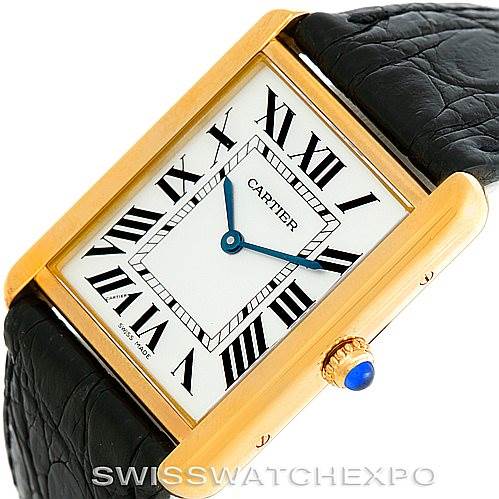 This image shows a close-up, angled view of the Cartier Tank Solo W1018855 Men
s Steel and Gold (two tone) Silver Dial W1018855 Men
s Steel and Gold (two tone) Silver Dial watch, highlighting the face, Roman numerals, and gold case with diamond crown.