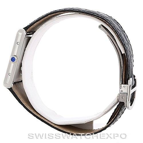 The image shows a side view of a Cartier Tank Solo W1018355 Men
s Stainless Steel Silver Dial W1018355 Men
s Stainless Steel Silver Dial watch, highlighting its crown and leather strap.