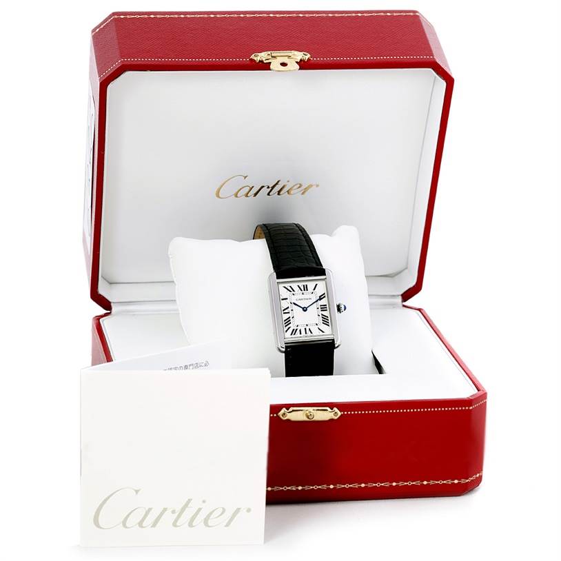 The Cartier Tank Solo W1018355 Men
s Stainless Steel Silver Dial W1018355 Men
s Stainless Steel Silver Dial watch is pictured front-facing in an open red Cartier box with accompanying documents.