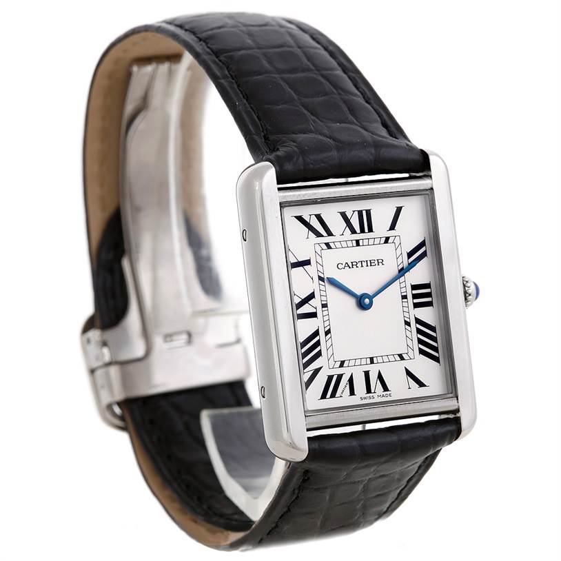 The image shows a Cartier Tank Solo W1018355 Men
s Stainless Steel Silver Dial W1018355 Men
s Stainless Steel Silver Dial watch at an angle displaying the face, Roman numerals, and part of the black leather strap.