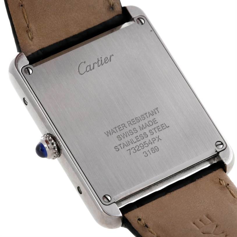 The image shows the back case and part of the leather strap of the Cartier Tank Solo W1018355 Men
s Stainless Steel Silver Dial W1018355 Men
s Stainless Steel Silver Dial watch.