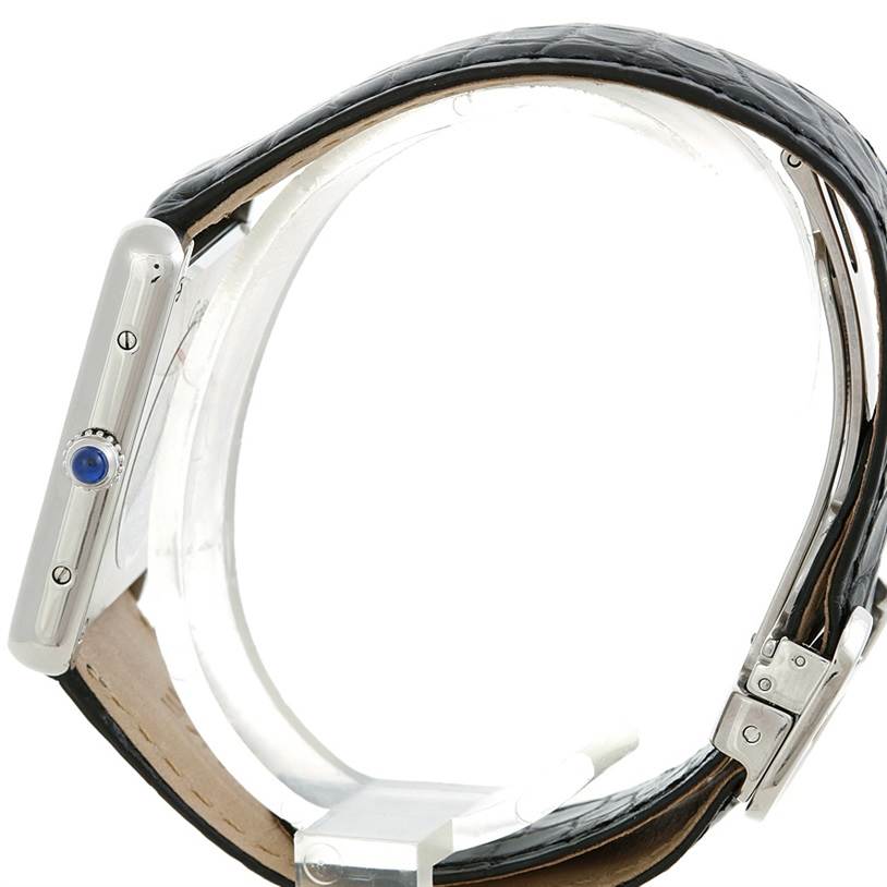 The image shows the side view of a Cartier Tank Solo W1018355 Men
s Stainless Steel Silver Dial W1018355 Men
s Stainless Steel Silver Dial watch, highlighting the crown, screws, and leather strap.