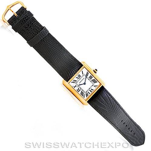 The Cartier Tank Solo W1018855 Men
s Steel and Gold (two tone) Silver Dial W1018855 Men
s Steel and Gold (two tone) Silver Dial watch is shown in an overhead view with its black leather strap and rectangular gold case fully visible.