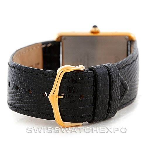 This image shows the Cartier Tank Solo W1018855 Men
s Steel and Gold (two tone) Silver Dial W1018855 Men
s Steel and Gold (two tone) Silver Dial watch from the back, highlighting its black leather strap and gold buckle.