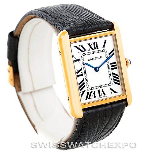 This image shows a side angle of the Cartier Tank Solo W1018855 Men
s Steel and Gold (two tone) Silver Dial W1018855 Men
s Steel and Gold (two tone) Silver Dial watch, highlighting the face, black leather strap, and gold rectangular case.