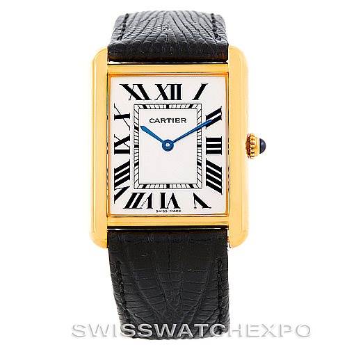 The image shows a front view of a Cartier Tank Solo W1018855 Men
s Steel and Gold (two tone) Silver Dial W1018855 Men
s Steel and Gold (two tone) Silver Dial watch, highlighting its gold case, black Roman numerals, and black leather strap.