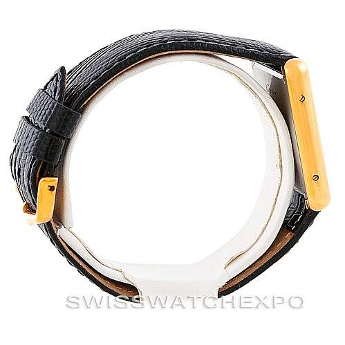 The image shows a Cartier Tank Solo W1018855 Men
s Steel and Gold (two tone) Silver Dial W1018855 Men
s Steel and Gold (two tone) Silver Dial watch from a side angle, highlighting the side profile, two-tone case, and black strap.