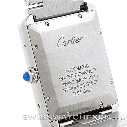 The image shows the back case and crown of the Cartier Tank Solo W5200028 Men
s Stainless Steel Silver Dial W5200028 Men
s Stainless Steel Silver Dial watch, highlighting its inscriptions and blue cabochon.