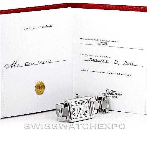 The image shows a Cartier Tank Solo W5200028 Men
s Stainless Steel Silver Dial W5200028 Men
s Stainless Steel Silver Dial watch placed in front of its certificate, displaying its face and stainless steel bracelet.