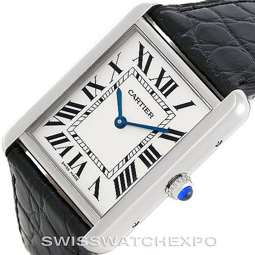 This image shows a Cartier Tank Solo W1018355 Men
s Stainless Steel Silver Dial W1018355 Men
s Stainless Steel Silver Dial watch from an angled top view, including the dial, crown, and a portion of the leather strap.