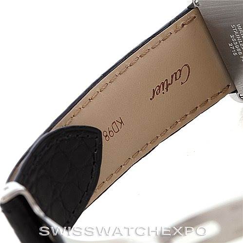 The image shows a close-up of the underside of the leather strap and the stainless-steel case back of a Cartier Tank Solo W1018355 Men
s Stainless Steel Silver Dial W1018355 Men
s Stainless Steel Silver Dial watch.