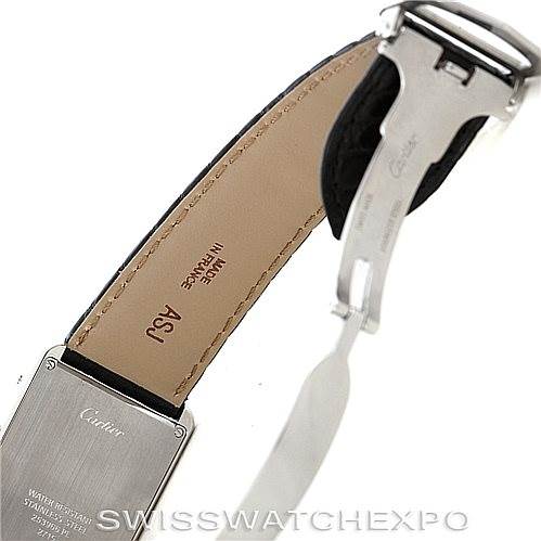 The image shows the underside of the strap and clasp of a Tank Solo model by Cartier, highlighting the back of the watch and part of the leather strap.